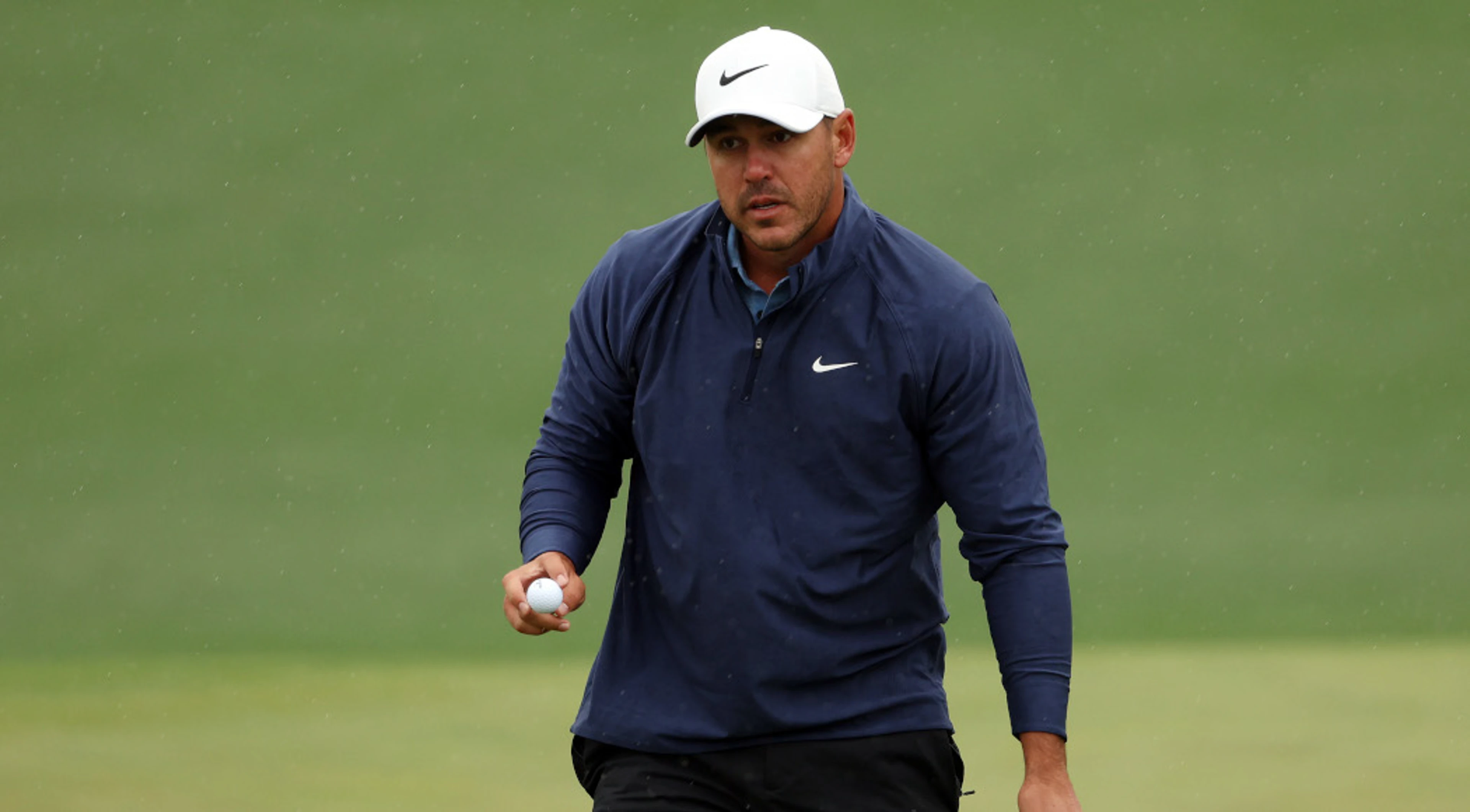Koepka extends Masters lead as play suspended