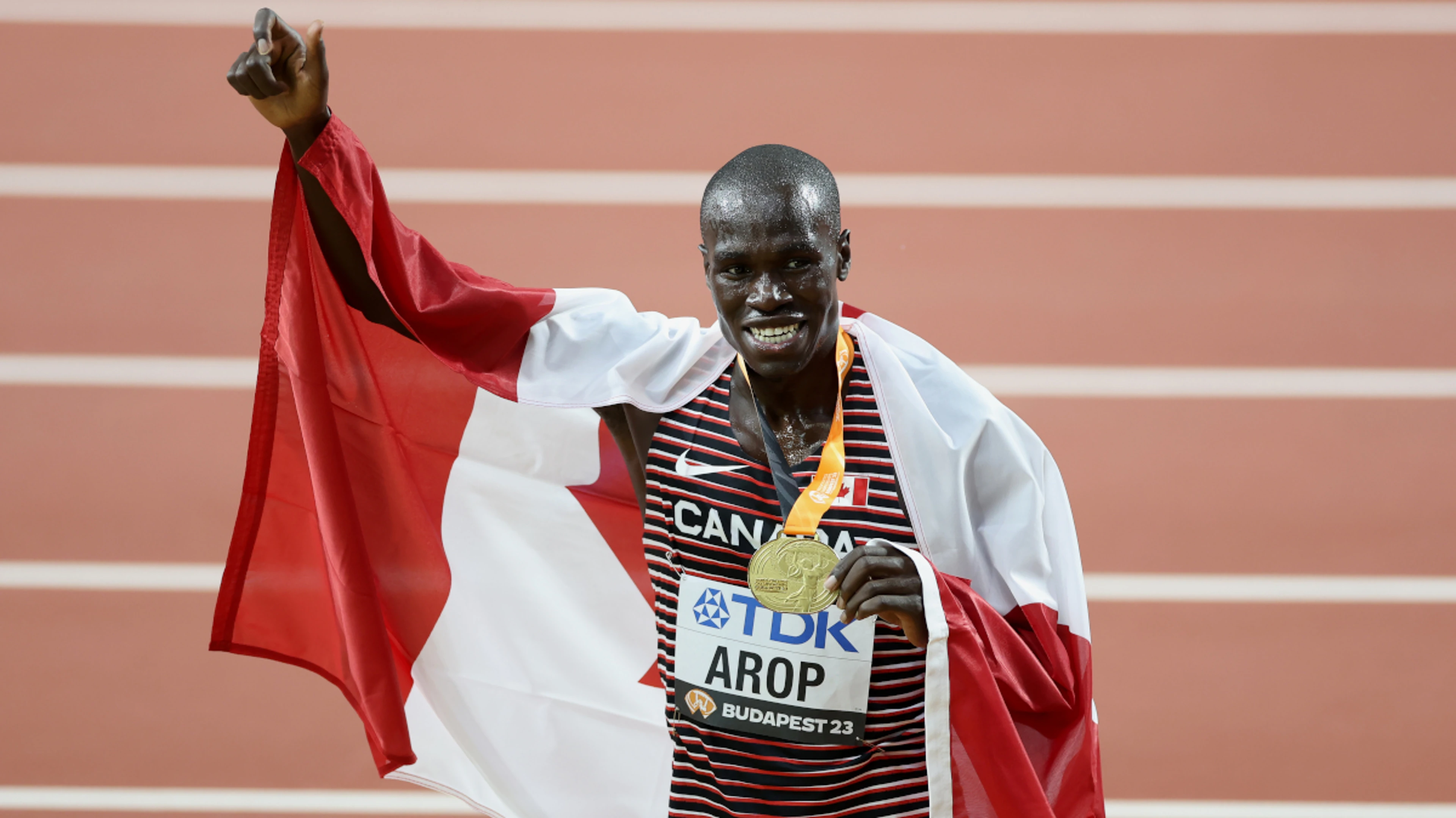 Arop goes from back to front to take 800m gold