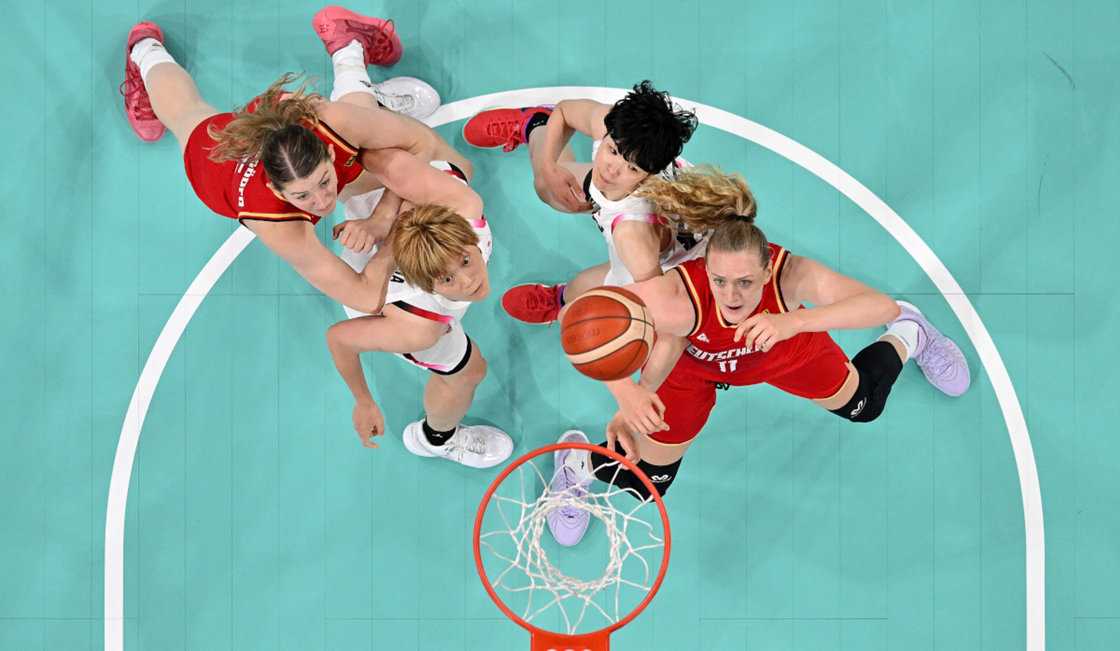 Germany make basketball quarterfinals, Australia beat Canada