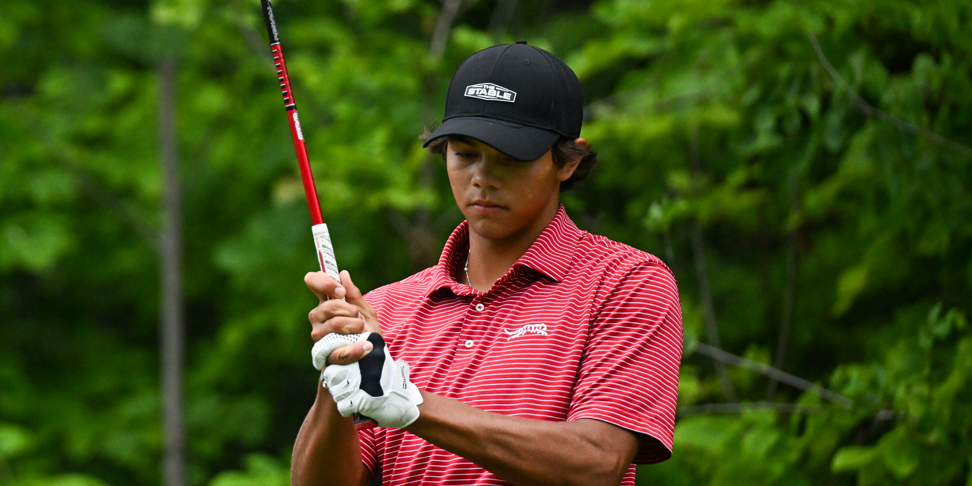 Line forming to recruit Charlie Woods ('27) with Tiger along for ride