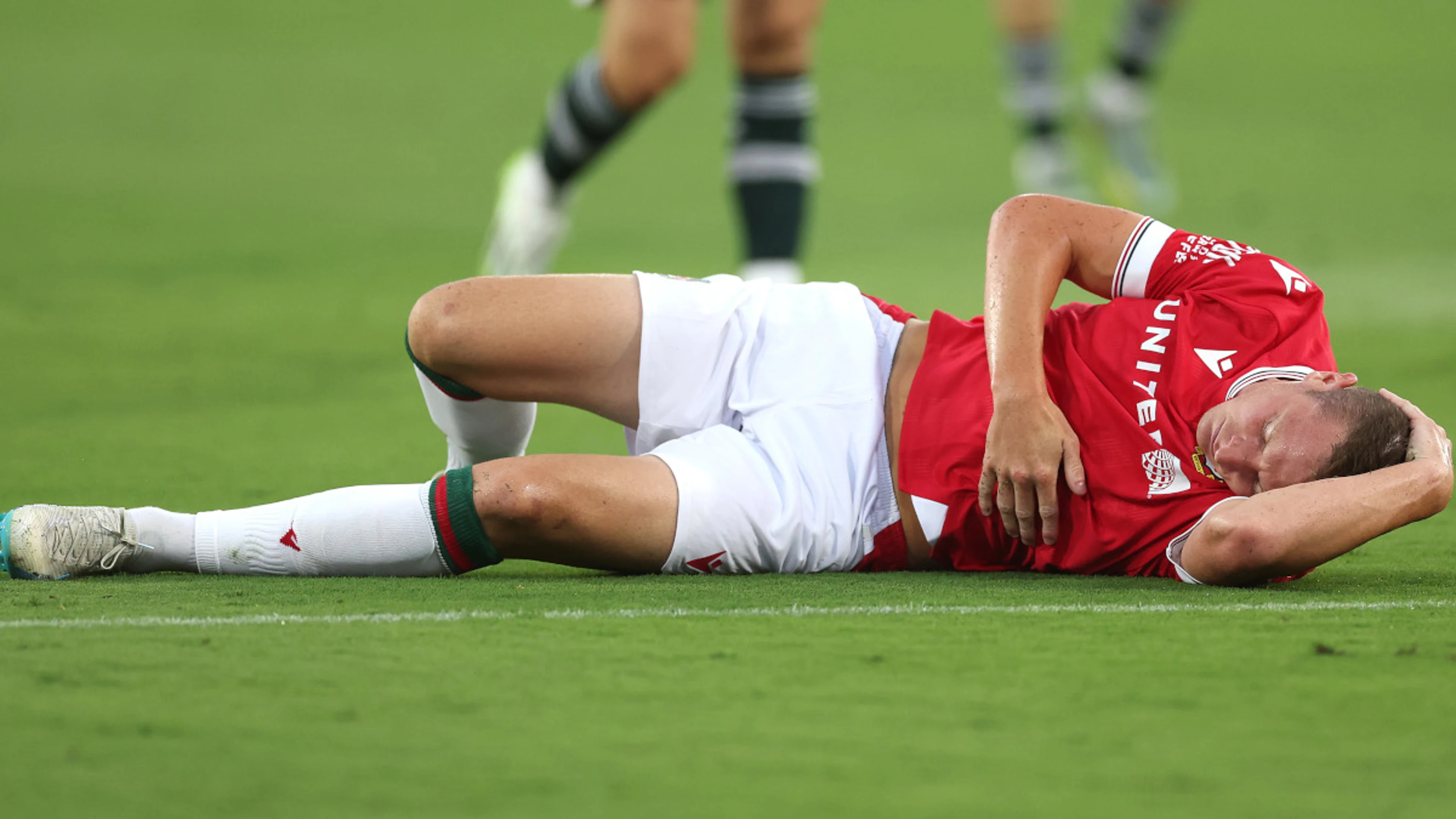 Wrexham striker Mullin punctures lung in pre-season win over Man Utd