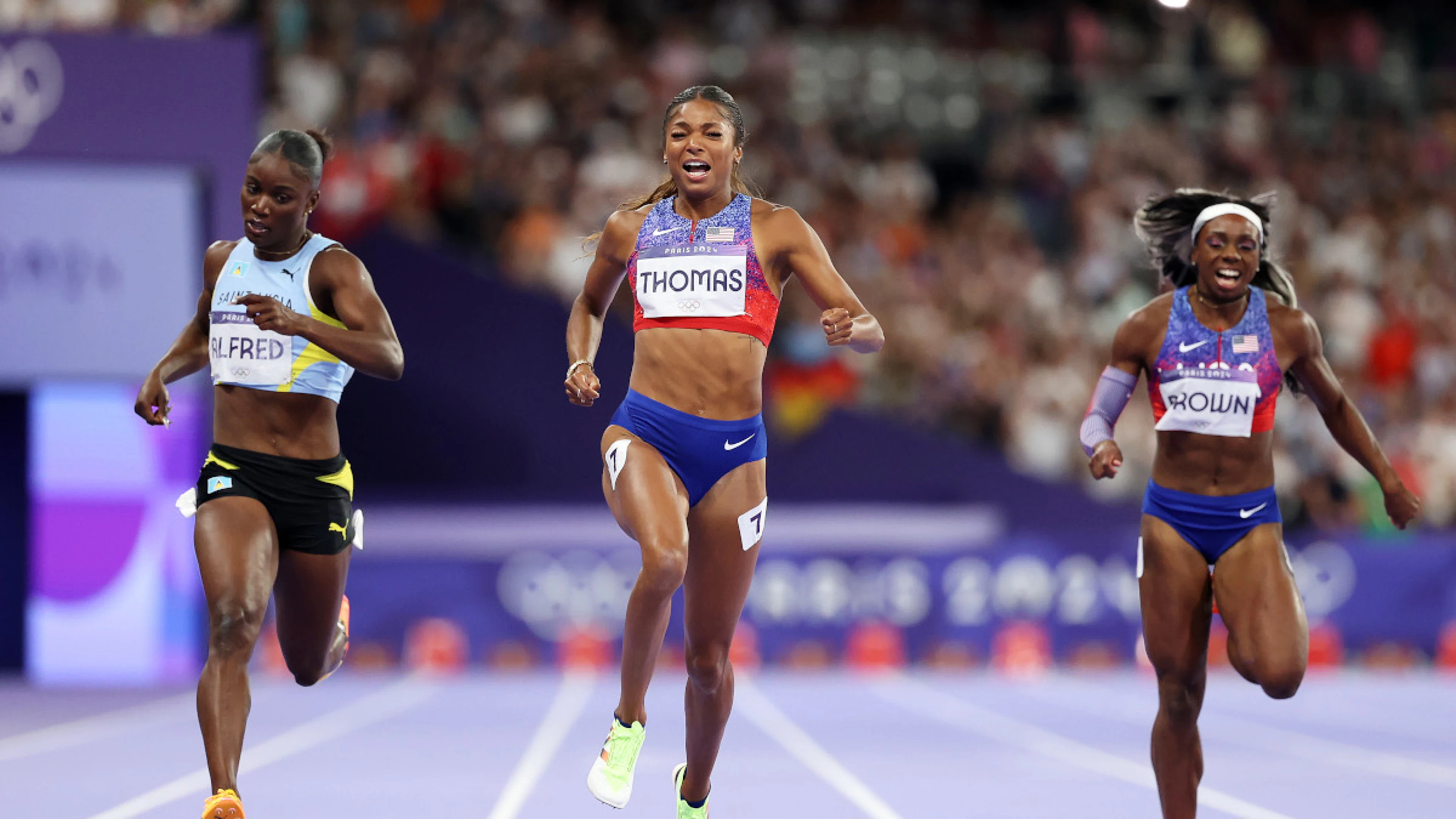 Brilliant Thomas wins Olympic 200m gold